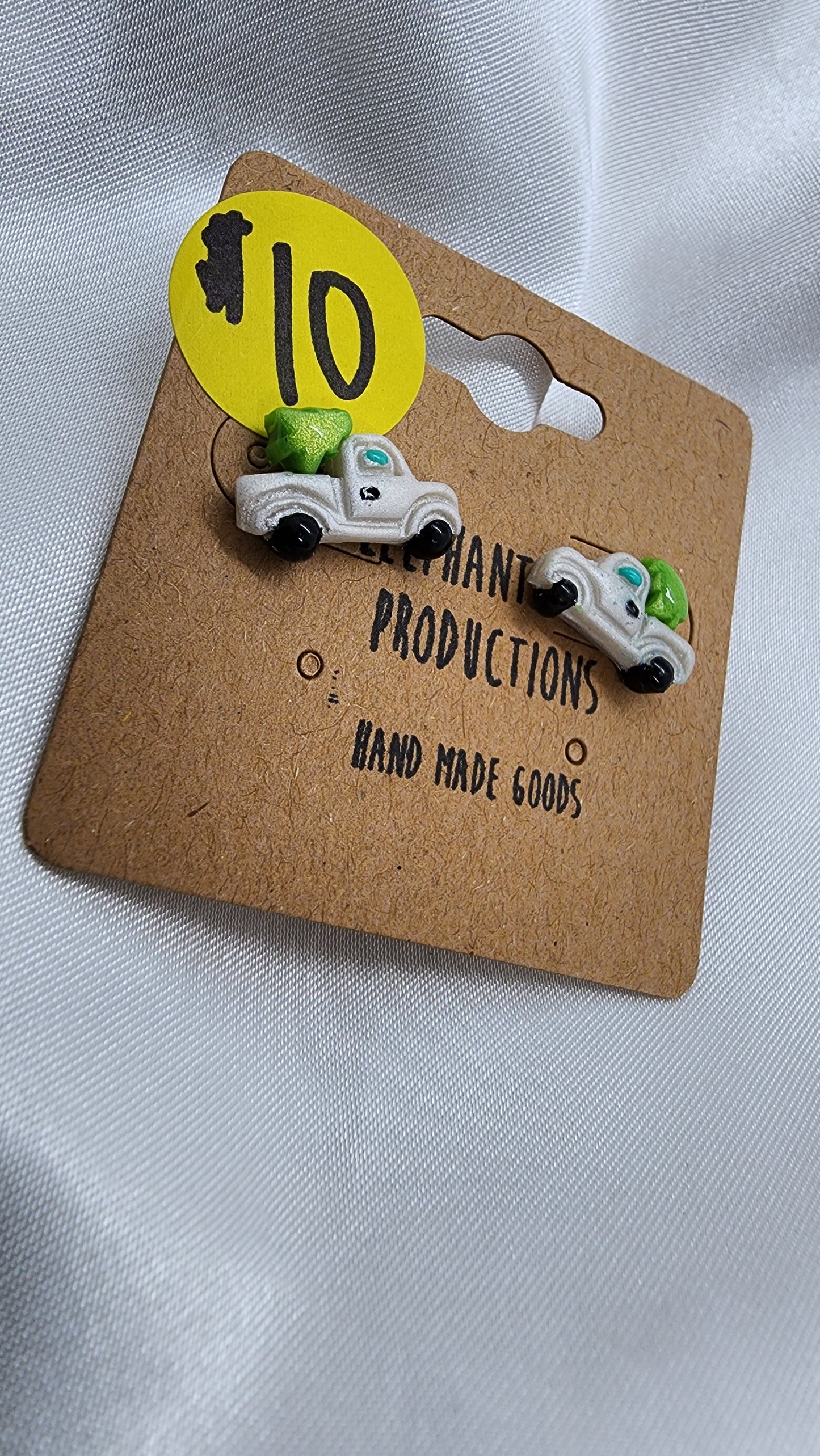 Little white truck hauling a Christmas tree earrings