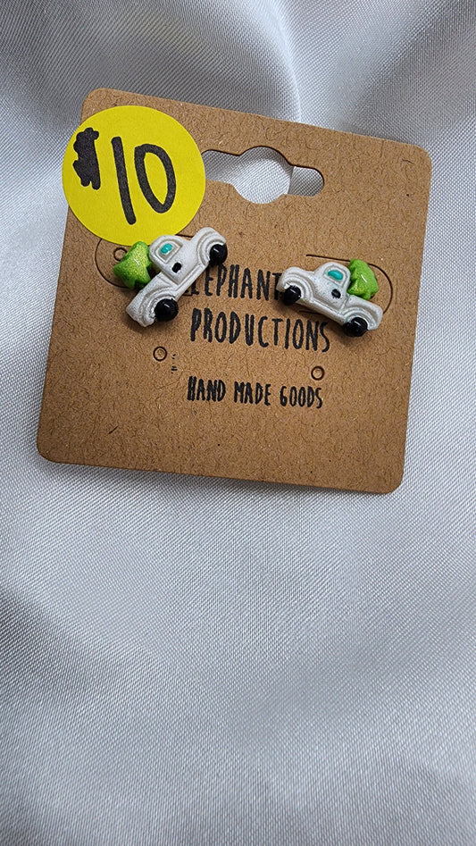 Little white truck hauling a Christmas tree earrings